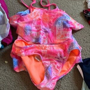 Girls 10-12, Pink, Orange, Blue, and Purple 2 piece swimming suit.